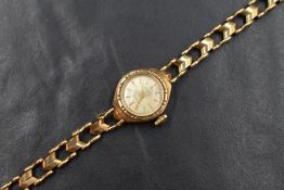 A 9ct gold cased Accurist wristwatch, the circular dial having baton numerals, marked 375, on a