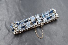 A vintage Sherman white metal paste set bracelet, the pale blue round cut paste interspersed with
