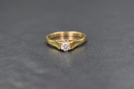 An 18ct gold diamond set solitaire ring, the diamond measuring approximately 0.50ct having good