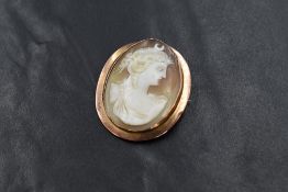 A 9ct rose gold cameo set brooch, the oval cameo depicting Selene Goddess of the moon, in a bezel