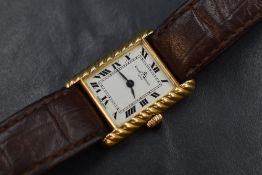 An 18ct gold Baume & Mercier wristwatch, the rectangular white dial having Roman numerals, in a rope