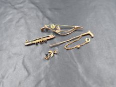Two yellow metal bar brooches, a small pendant and a tie pin, all stamped 9ct, the tie pin being