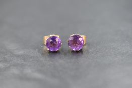 A pair of 9ct gold amethyst stud earrings having claw set mounts, approx 1.8g gross