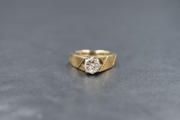 A 9ct gold diamond set solitaire ring, the round brilliant cut illusion set diamond with