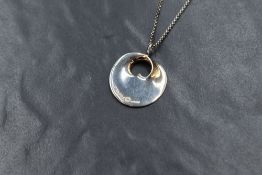 A Danish silver Georg Jensen hidden heart pendant with chain designed by Vivianna Torun, with case