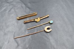 Four 9ct gold bar brooches and stick pins, comprising a bezel set opal stick pin marked 9ct, a