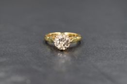 An 18ct gold diamond solitaire ring, the brilliant cut diamond being approx 1.5ct set in a raised