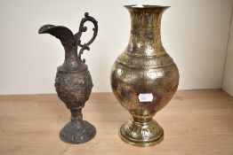 An early 20th century Middle Eastern brass vase of lobed form, decorated with hunting scenes, h28.