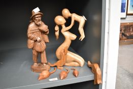 A hand carved wooden sculpture of a barefooted beggar, h30cm, sold together with 3 wooden mice and