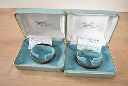 A hinged silver bangle having engraved scroll decoration and concealed clasp, approx 18.6g and