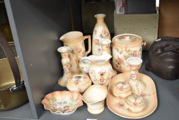 A quantity of Ducal ceramic wares, decorated with floral patterns on a blush ivory ground, to