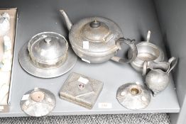 A Pewter tea pot having shaped handle and spout, h12cm, sold together with a pair of candlesticks,