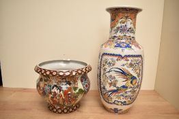 A ceramic planter of baluster form, decorated with Chinese figures and geometrical patterns,