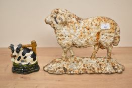 A cast iron door porter in the form of a ram, h18cm, sold together with a cow door porter, (2)