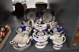 A Victorian Gaudy Welsh feather pattern tea service, decorated in colbert blue and floral patterns