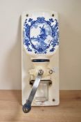 A 20th century hand cranked coffee grinder having glass hopper, h34cm