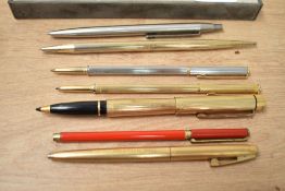 A selection of ballpoint pens including Waterman Targa Slim in gold and silver Sheaffer Rollerball