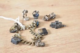 A silver double link charm bracelet having padlock clasp and eight charms, (4 loose) including