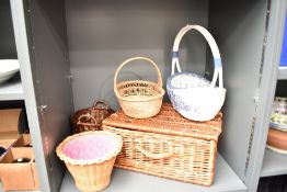 A wicker basket, L52cm, sold together with 4 other baskets, (5)