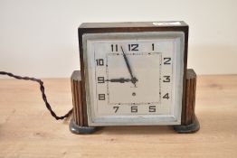 An art deco style oak mantel clock