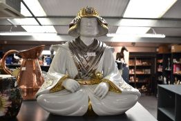 A porcelain statue of a Samurai Warrior in seated position, believed to be by San Marco, made in