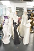 Four Royal Doulton bone china figurines comprising Reflections series 'Sophistication' HN 3059, '