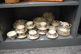 A Royal Cauldon 'Victoria' pattern dinner service, decorated with gilt edge and floral patterns,