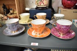 A set of Favolina Harlequin cups and saucers, makers mark to base, made in Poland, (12)