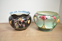 An oriental style jardinière having chinoiserie decoration on a black ground, h18cm, sold together