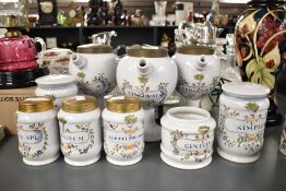 A set of three 20th century Chemist apothecary water jugs with covers, to include Zingiberis,