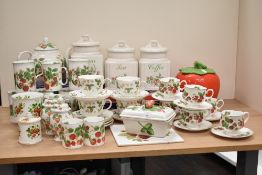 A Roy Kirkham 'Strawberry' pattern fine bone china tea service, to include tea pots, cups and