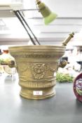A large bronze pestle and mortar, decorated with Renaissance style relief decoration, h21cm