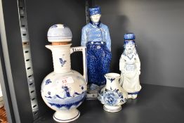 A rare Royal Delft blue and white Farmer figure, h28.5cm, sold together with a Delft Dutch girl, a