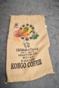Three Hessian coffee sacks with printed details and designs.