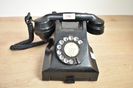 A vintage black bakelite telephone, h14.5cm