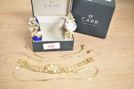 A group of three wristwatches, two having cuff bracelet straps and one being a Sekonda, with a