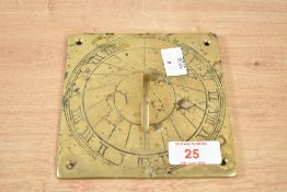 A brass sundial having Roman numerals, w12.5cm