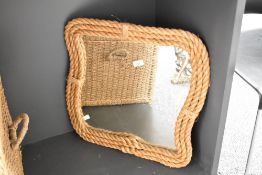 A 20th century mirror having rope border, w50cm