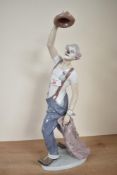 A large Lladro porcelain figure 'Hats off to Fun' model number 5765, measuring 42cm tall.