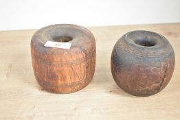 A horse nogging/stable log, having central hole and four stripe banding, h8.5cm, sold together