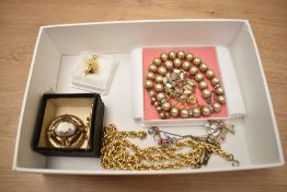 A collection of costume jewellery, including faux pearls and necklaces