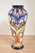 A Moorcroft pottery 'Geneva' pattern vase of lobed form, having tube line decoration, impressed