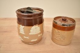 A Doulton Lambeth stoneware lidded tobacco jar, having silver rim with rubbed hallmarks and