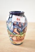 A Moorcroft pottery 'Geneva' pattern vase designed by Phillip Gibson, having tube lined decoration
