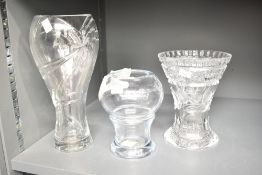 A Stromberqshyttan Swedish glass vase of lobed form, signed to base, h18cm, sold together with two