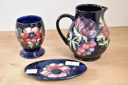 A Moorcroft pottery 'Anemone' pattern pitcher, having tubelined decoration, impressed and painted