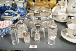 A circular cut glass fruit bowl having chrome edge and decorated with geometric patterns, w19cm,