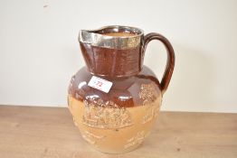 A Victorian stone ware hunting jug in the style of Doulton Lambert pottery, having silver collar rim