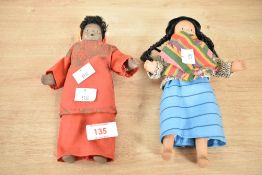 A porcelain South American doll in traditional dress, h21.5cm, sold together with similar doll, (2)