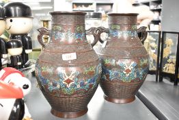 A pair of late 19th / early 20th century Chinese bronze Urns of baluster form, decorated with Foo